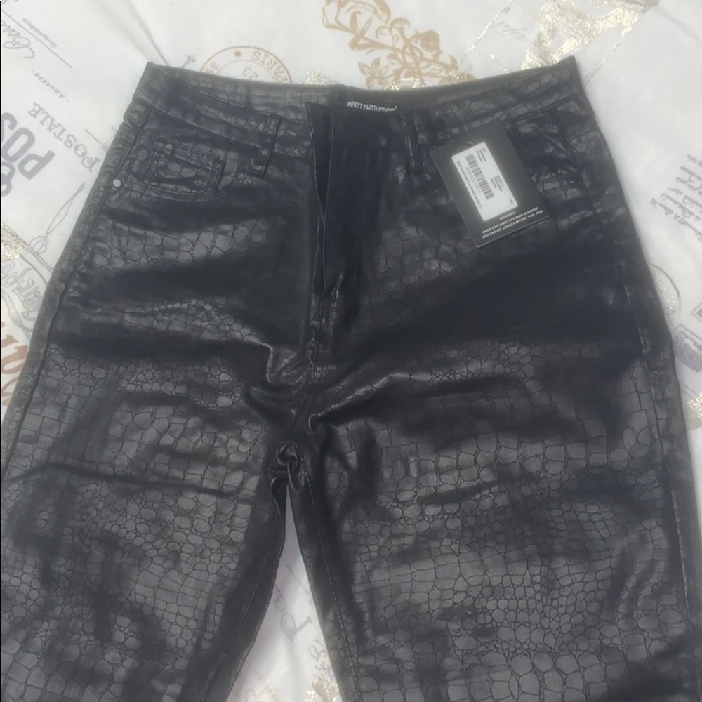Snake skin coated denim jeans